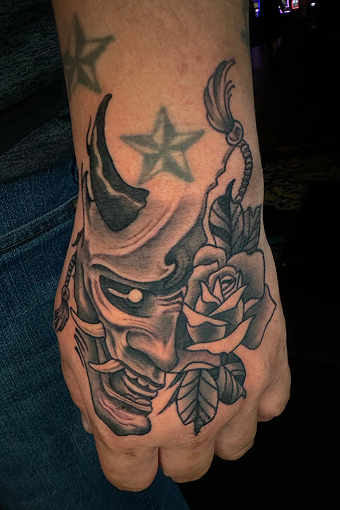 Fine line floral tattoo